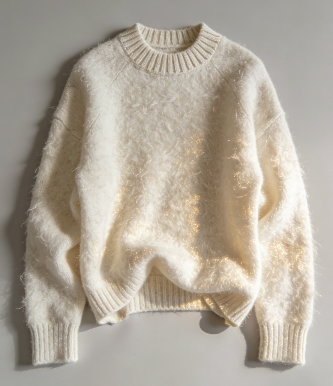 a white sweater on a white surface